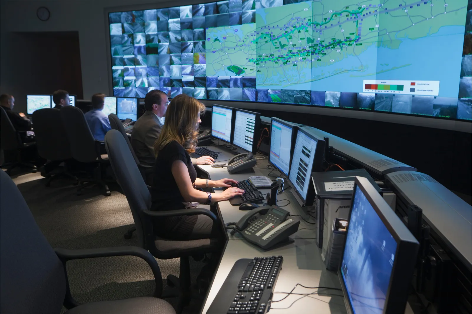 Staff work in the control room at the INFORM (Information for Motorists) Transportation Management Center on Long Island in New York.
