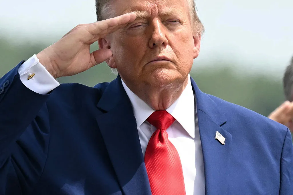 US President Donald Trump salutes as he attends a dignified transfer solemn event for US service members killed during operations in the Middle East, at Dover Air Force Base in Dover, Delaware, on July 22, 2026. (Photo by SAUL LOEB / AFP via Getty Images)