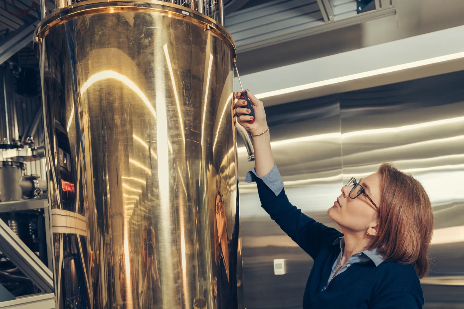 IBM researcher Olivia Lanes installing a thermal shield on a quantum dilution refrigerator; IBM Thomas J Watson Research Lab, Yorktown Heights, New York; June 23, 2026