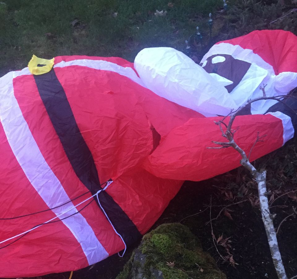 Inflatable Black Santa Claus Slashed in Yard; Neighboring White Santas ...
