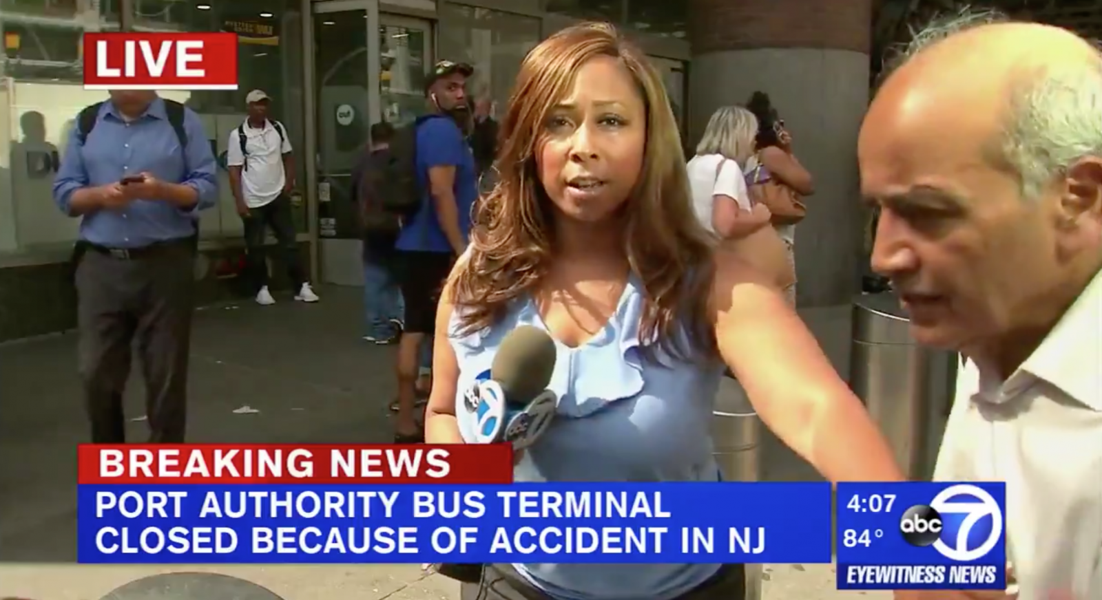 Cool-as-Cucumber TV Reporter Effortlessly Blocks Man from Entering
