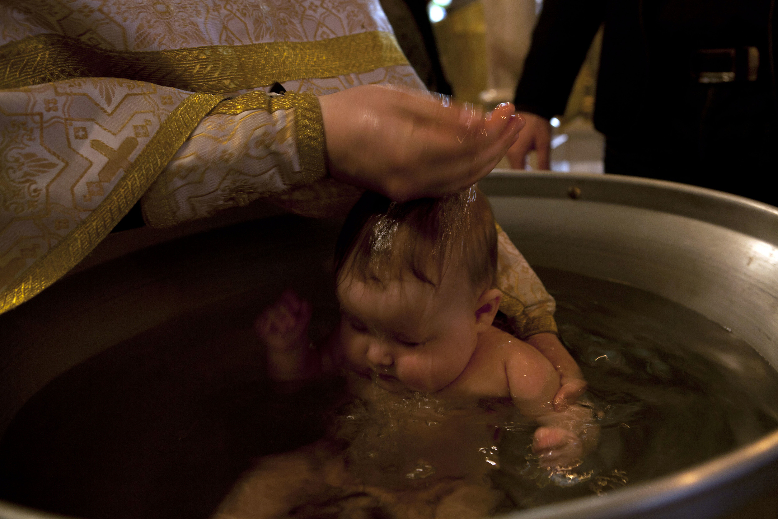 Russian Orthodox Priest Banned after Violently Baptizing One-year