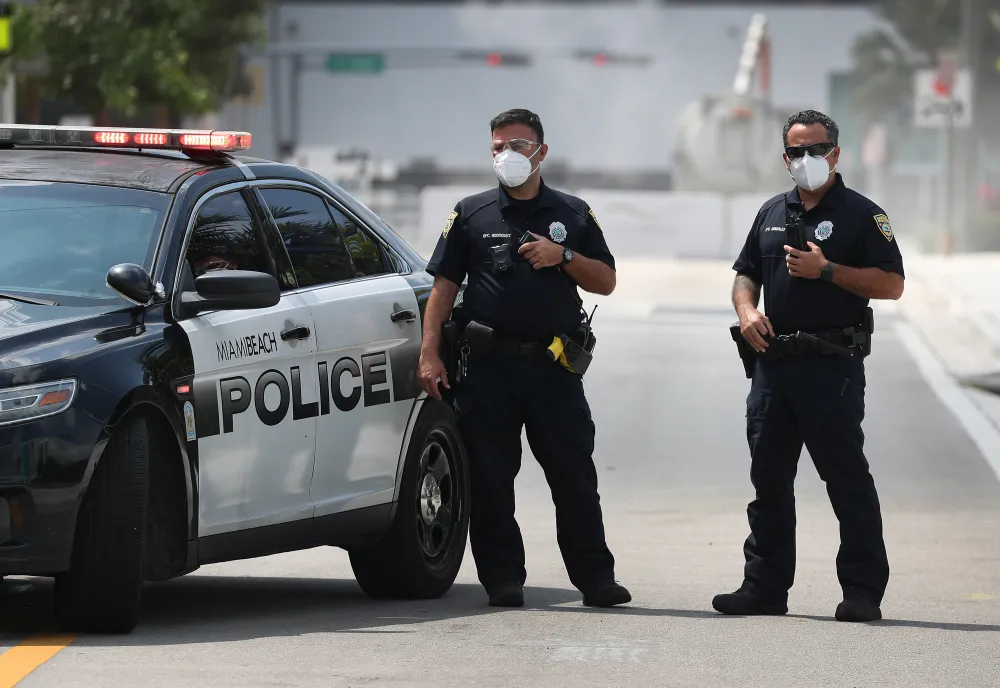 Iowa Man Accused of Coughing on Police Officer in Attempt to Give Him ...