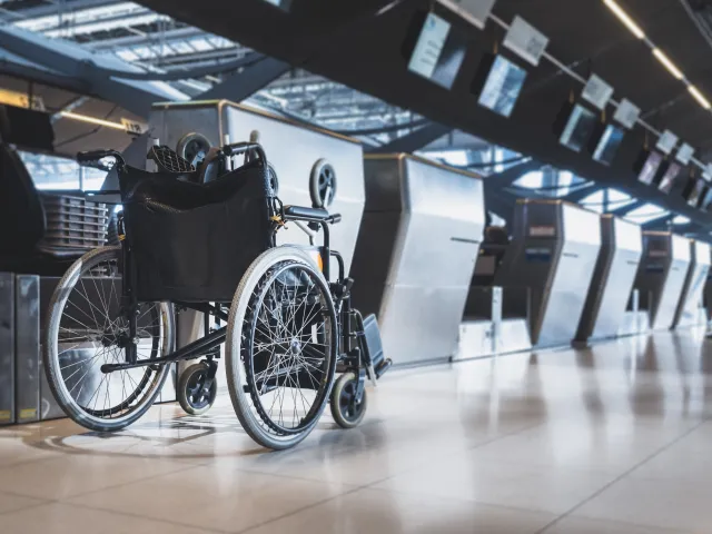 A wheelchair in an airport.