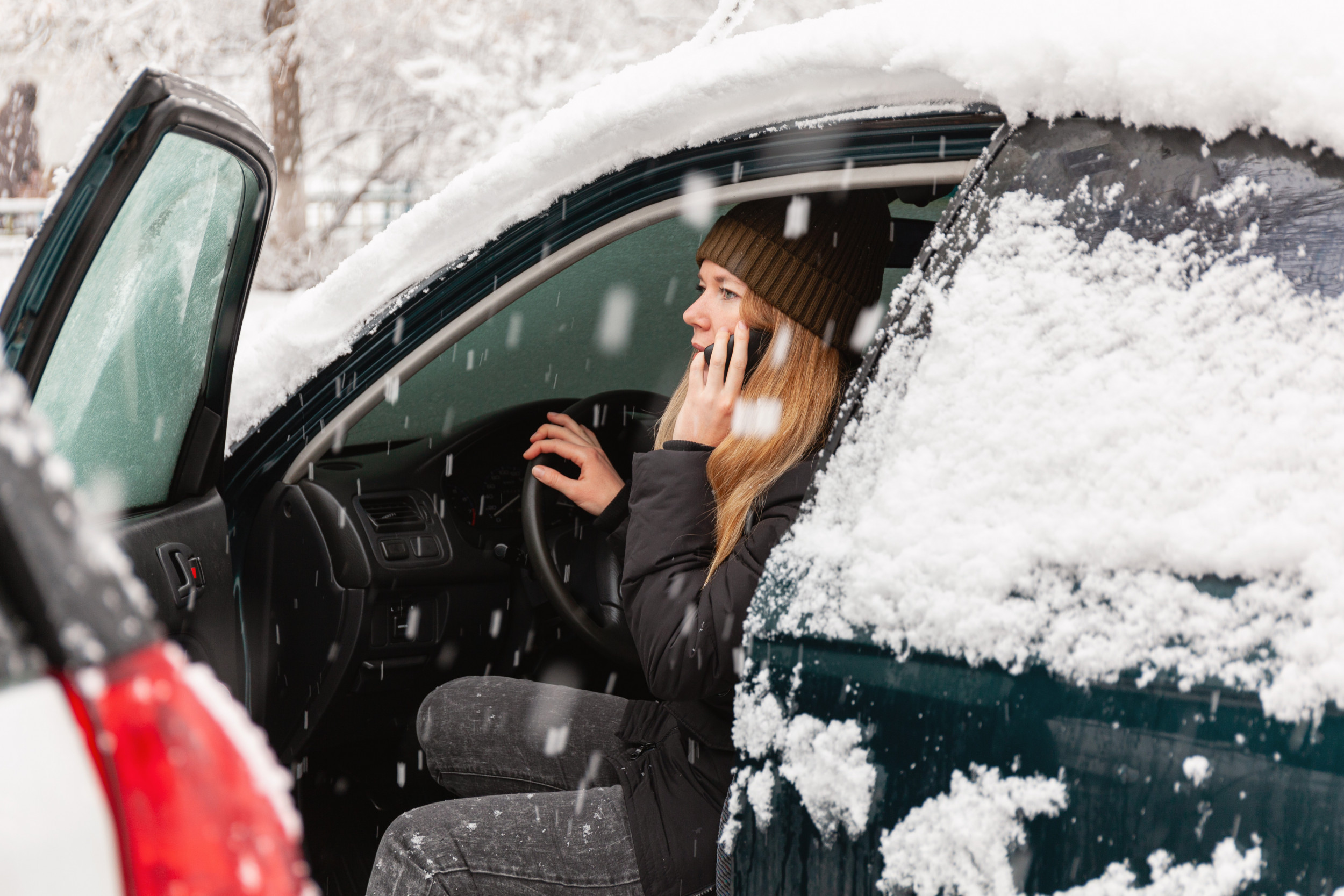 Woman Backs Out of Garage After Snowstorm—What Camera Captures Stuns