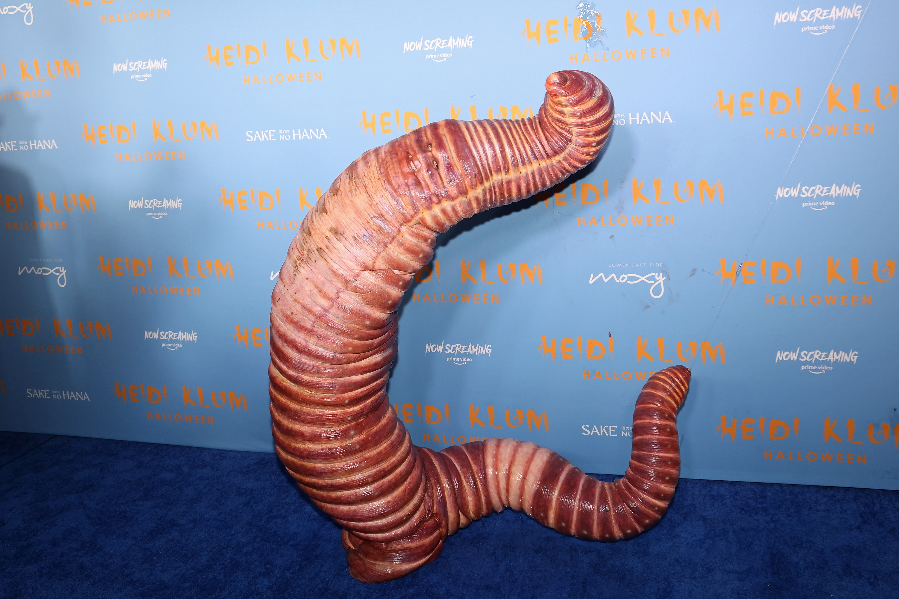 lady dressed as worm New Clip of Heidi Klum Wiggling Goes Viral: 'Terrifying' label_us_USA 2 DAY DELIVERY