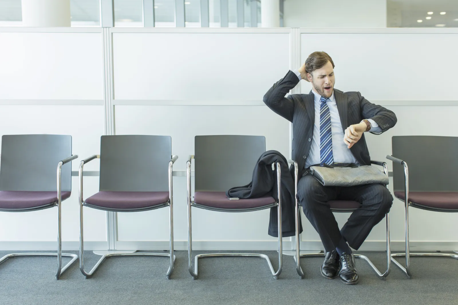 Man waiting in office reception area