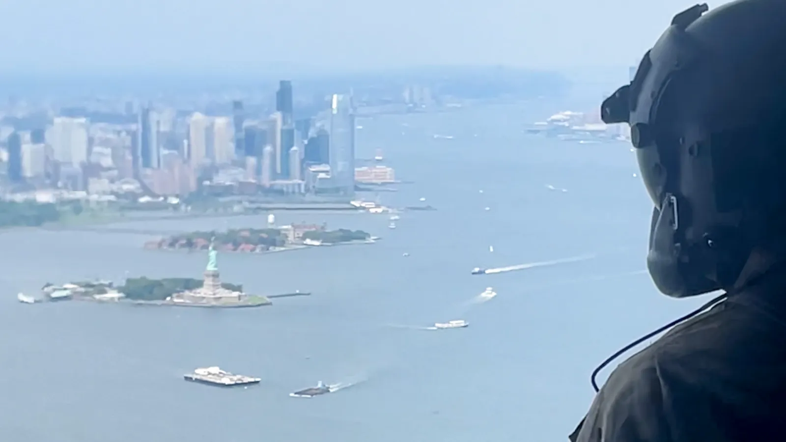 As A Helicopter Circles the Statue of Liberty, New Military Journeys Begin