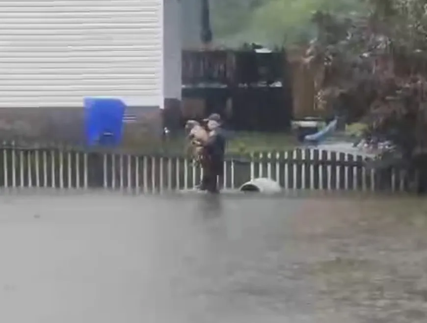 Video Shows Police Officer Save Dog Tied to Fence Amid Ophelia Flooding ...
