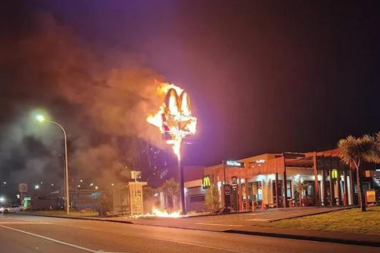 McDonald's Sign Engulfed in Flames While Staff Inside Restaurant