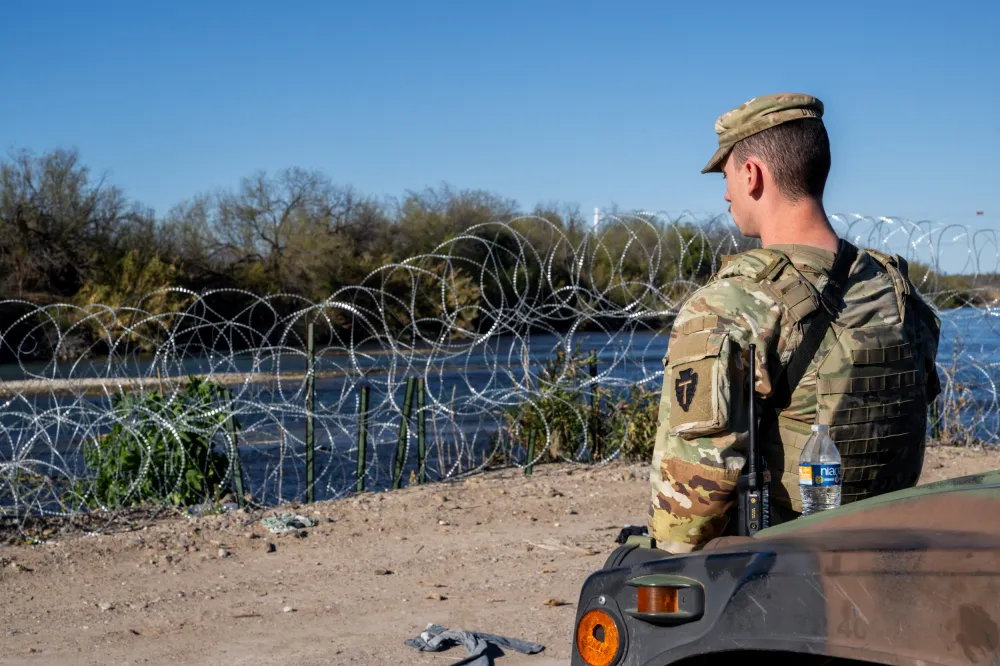 Greg Abbott Defies Joe Biden as Texas Begins Arresting Migrants - Newsweek