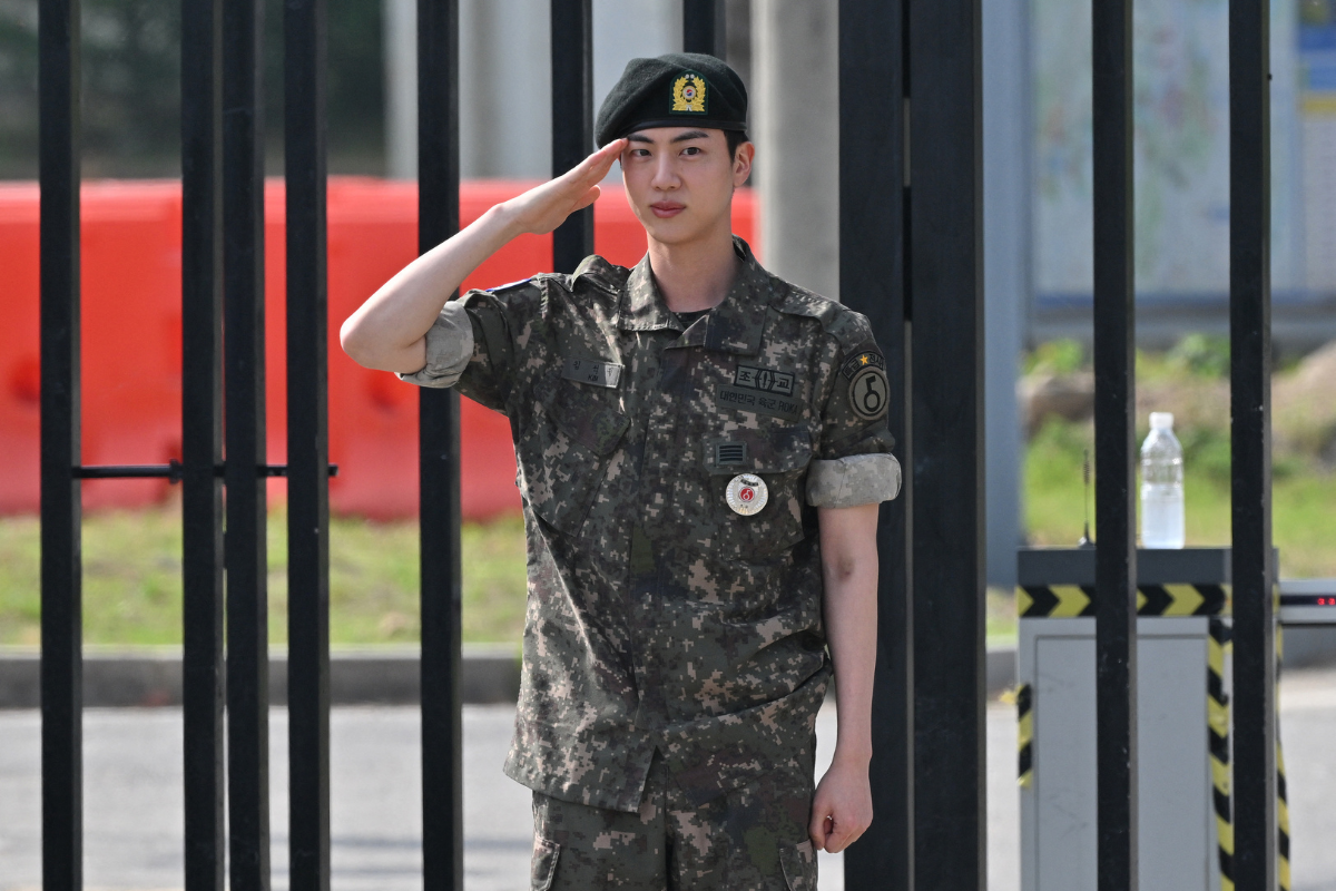 2408424-jin-salutes-after-