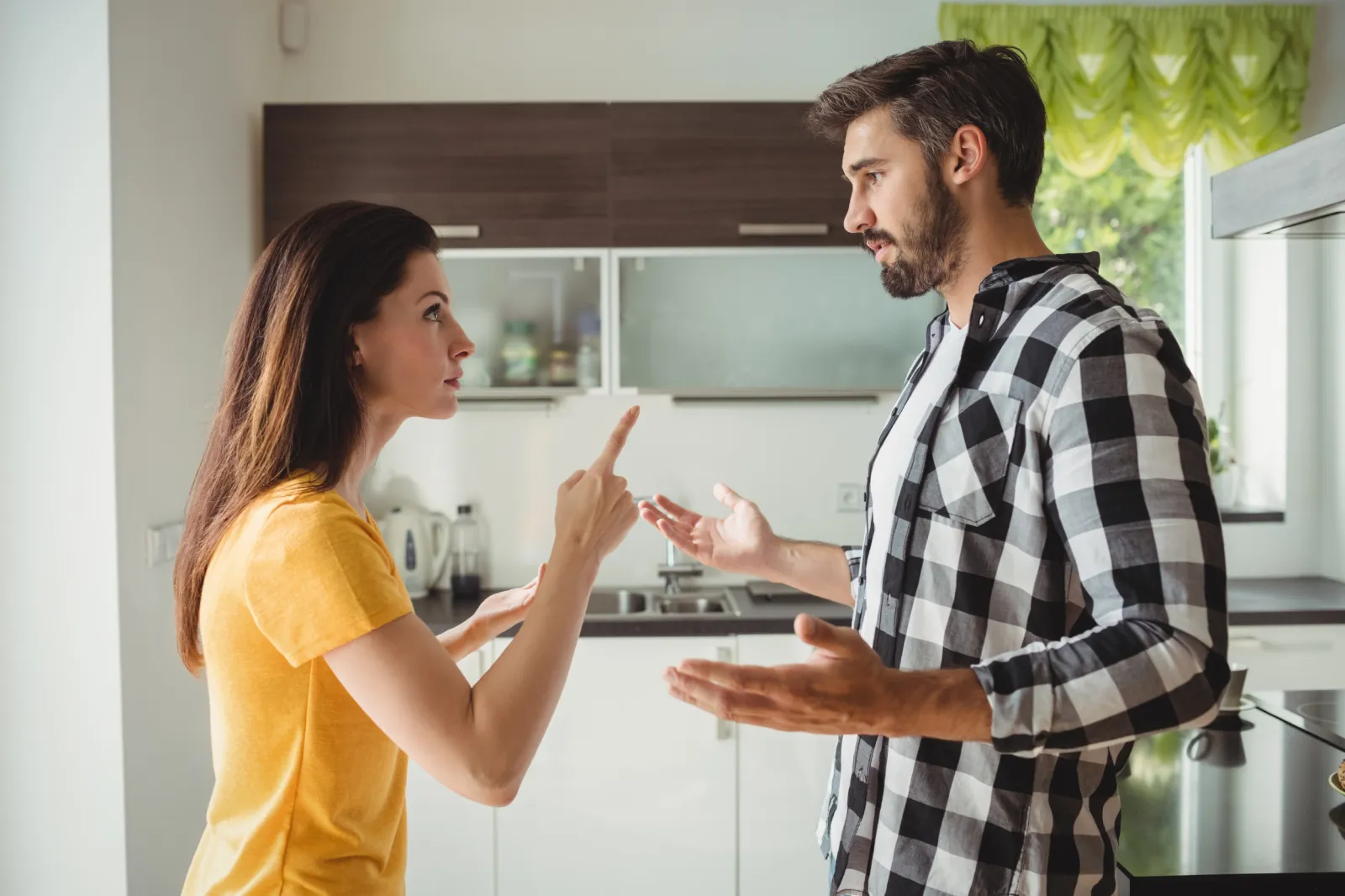 couple arguing in kitchen
