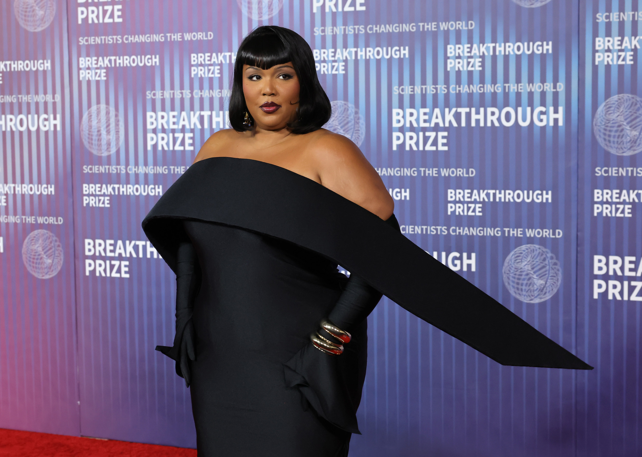 lizzo black dress Lizzo protests Tennessee law with drag queen concert moment