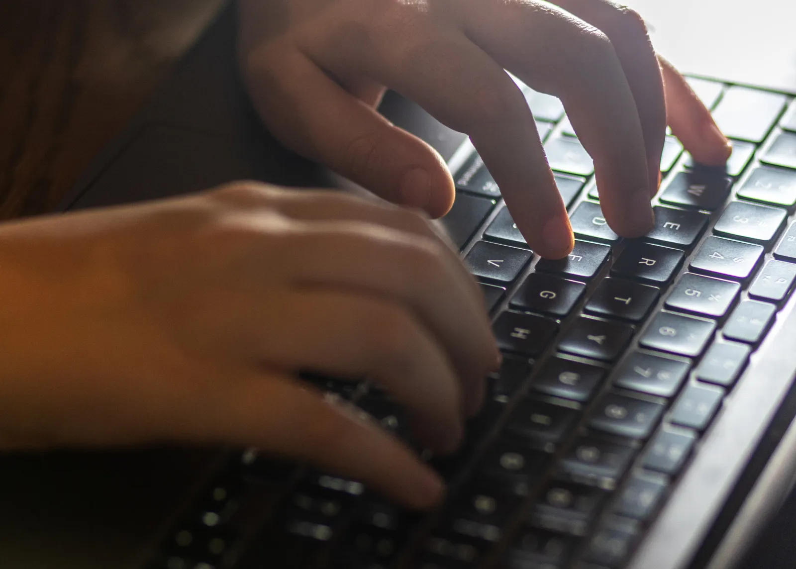 Hands keyboard FBI computer scam