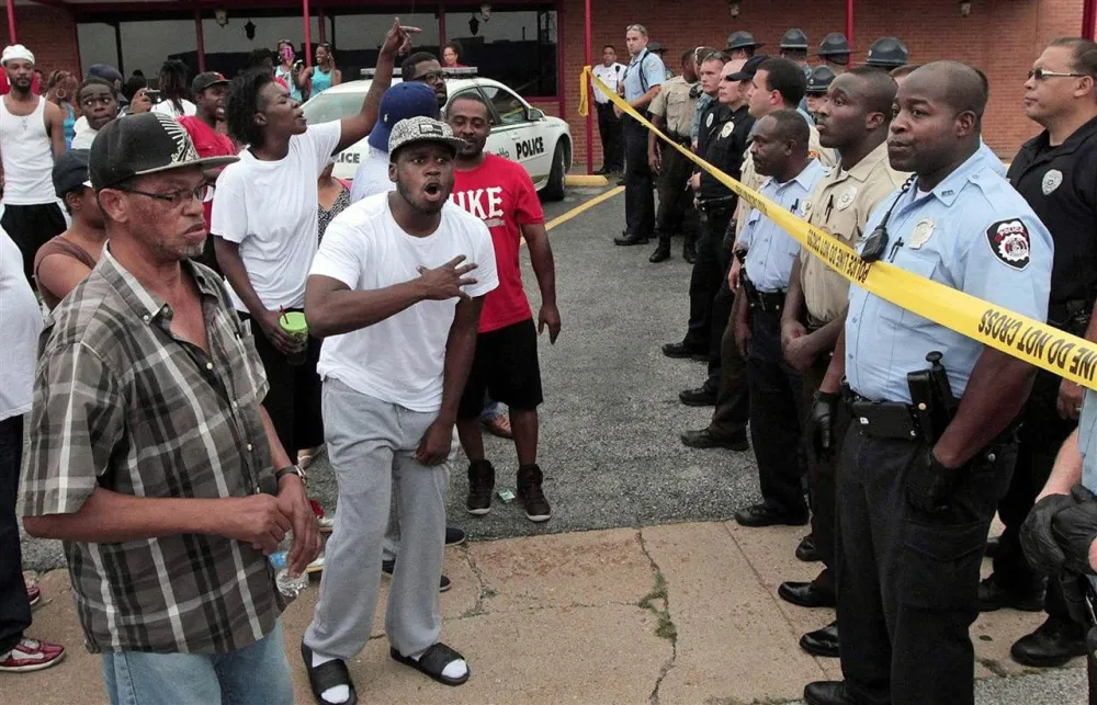After Fatal Shooting of an Unarmed Black Teen, Police Arrest 32 for ...