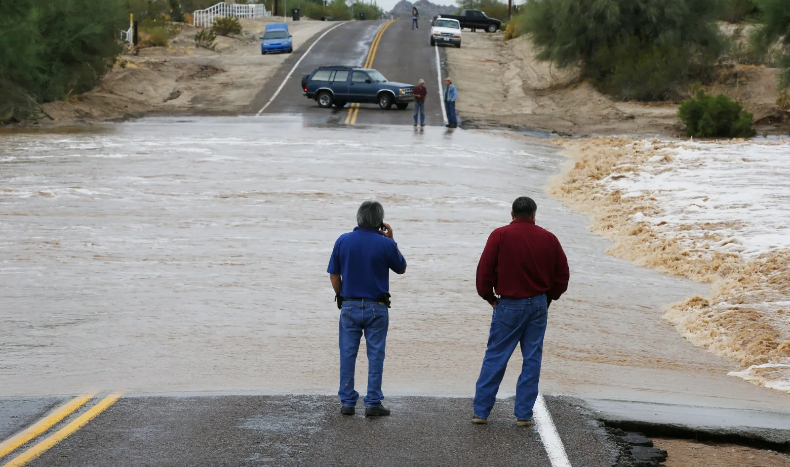 Authorities in Phoenix Rescue Woman Trapped in Car in Flood Waters ...