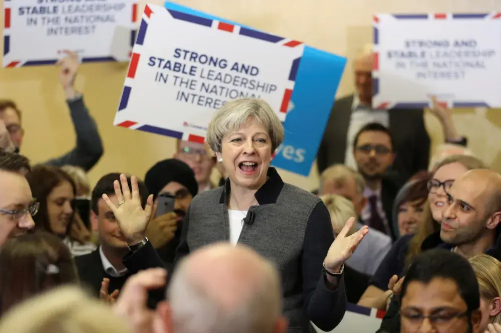 UK’s May Holds Lead in Election Polls While Opposition Support Rises
