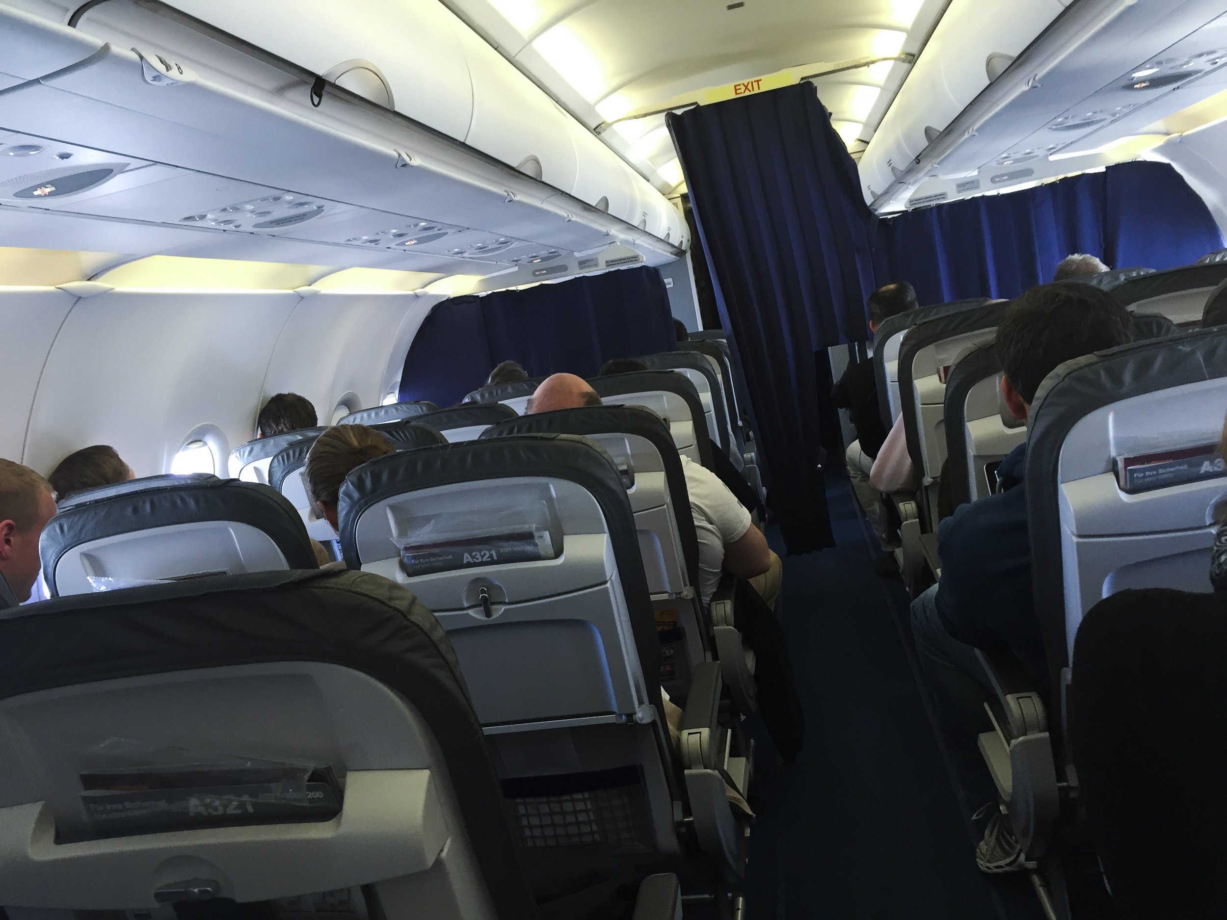 Plane Passenger Books Aisle Seat—Can't Believe What Happens One Row Behind