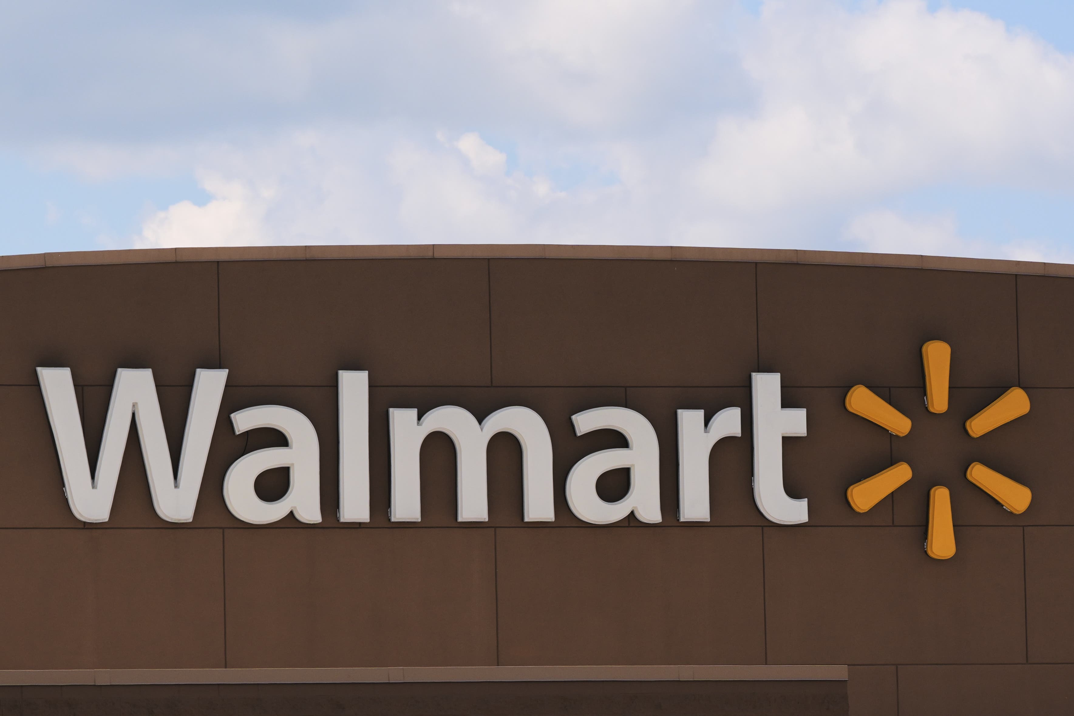 Walmart store front with recall warning notice for consumer safety