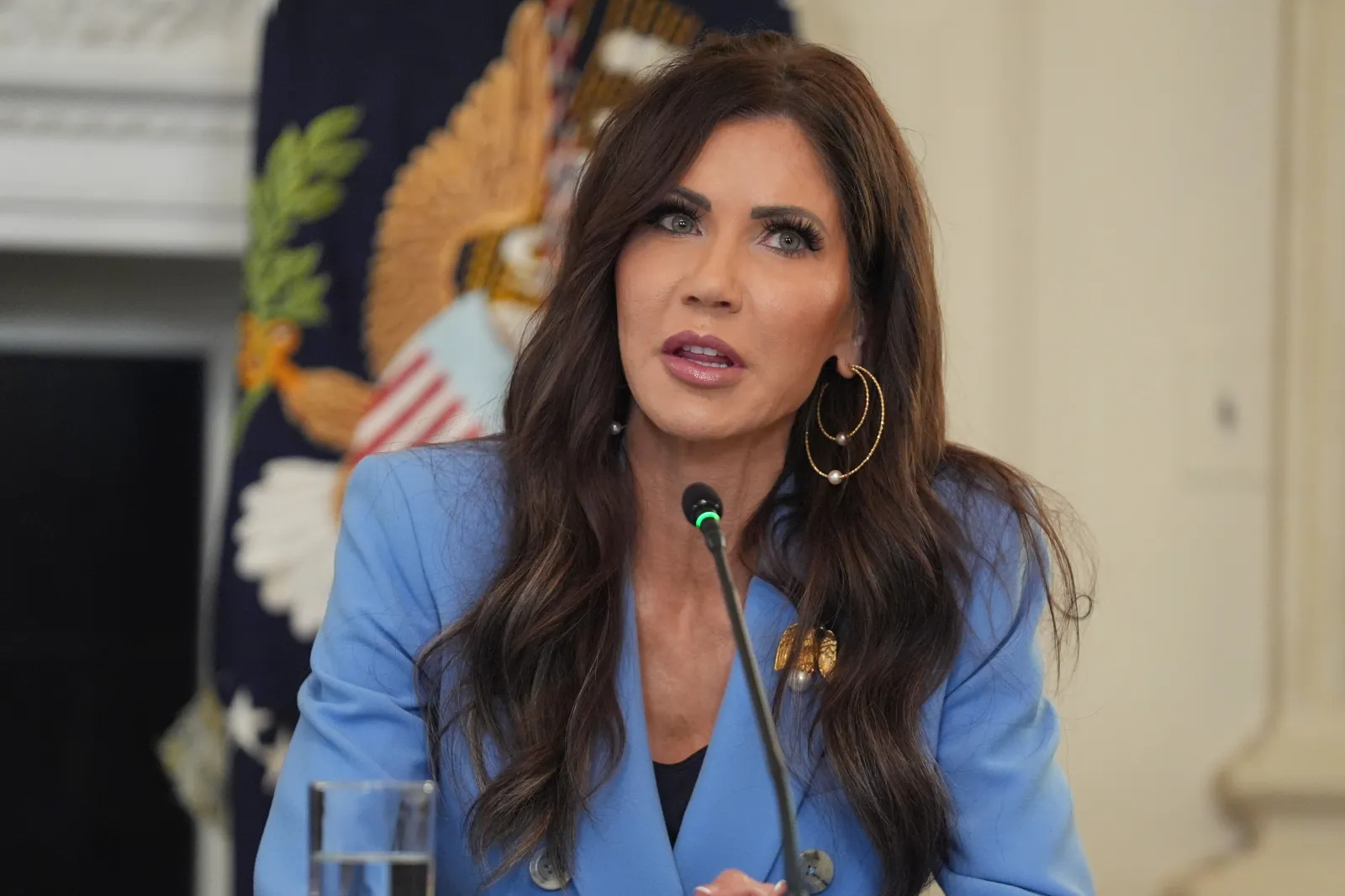 Homeland Security Secretary Kristi Noem speaks during a roundtable meeting with President Donald Trump on antifa in the State Dining Room at the White House, Wednesday, October 8, 2025, in Washington.