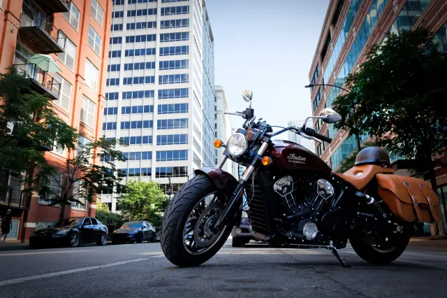 Motorcycle parked on side of the street.