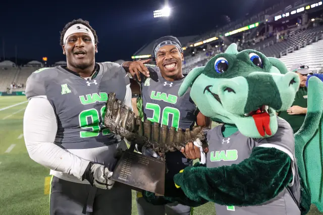 UAB Blazers players celebrating after beating the No. 22 ranked Memphis Tigers