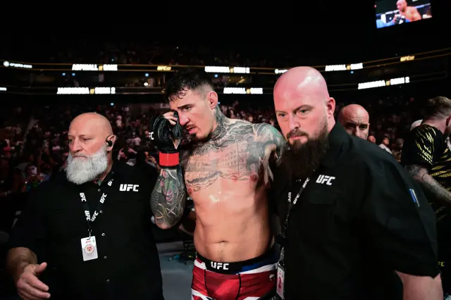 Britain's Tom Aspinall leaves the ring after being hit in the eye while fighting France's Ciryl Gane during their UFC heavyweight title bout at UFC 321 at Etihad Arena in Abu Dhabi early on October 26, 2025.