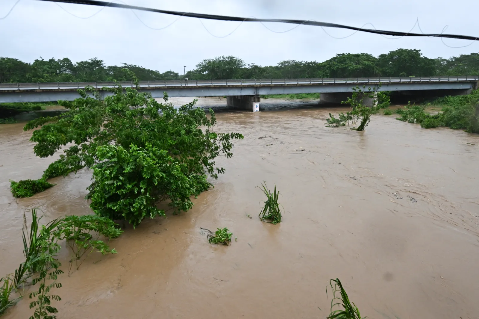 The Rio Cobre exceeded its banks near St. Catherine, Jamaica, shortly before Hurricane Melissa made landfall on October 28, 2025. (RICARDO MAKYN/AFP via Getty Images)