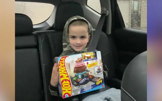 Kendra Leon's son Tyler clutching his Hot Wheels.