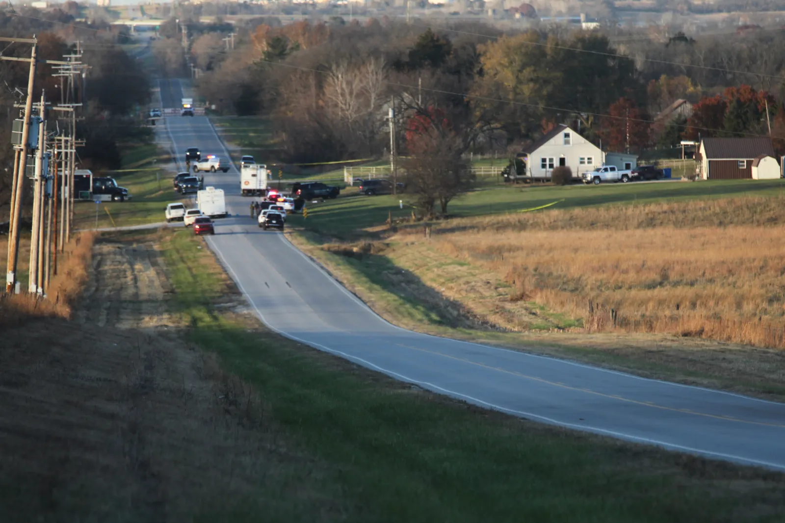 Law enforcement blocks the road to the scene of a shooting, which resulted in multiple casualties on November 15 in Carbondale, Kansas. (AP Photo/John Hanna)