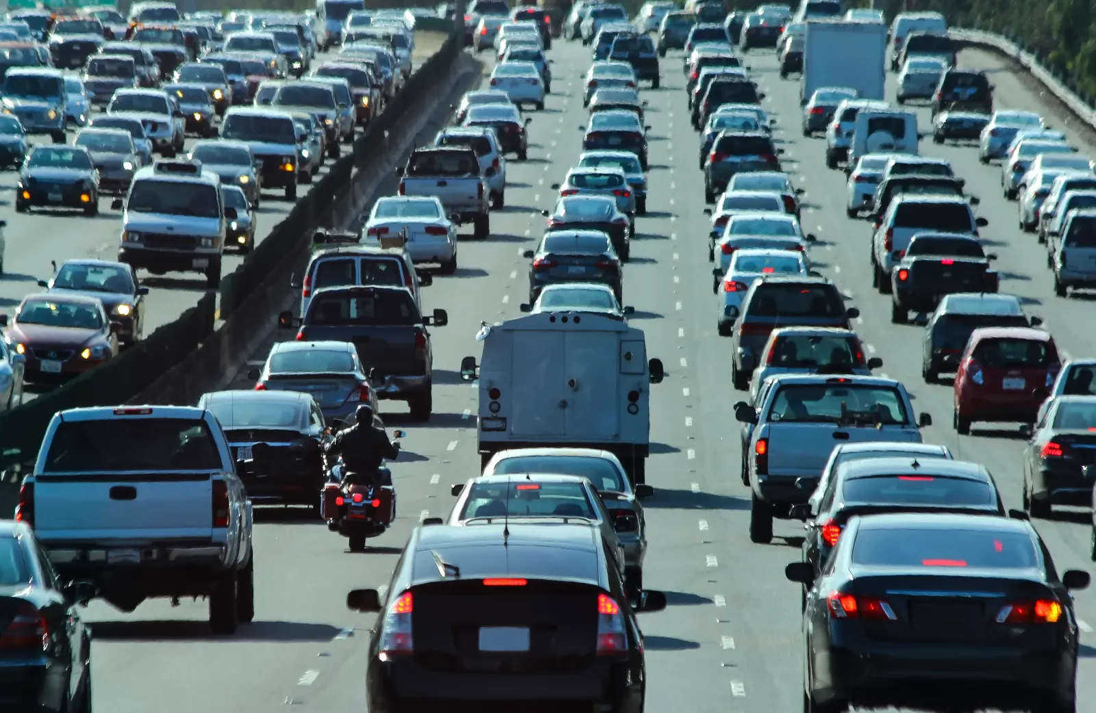A stock image of crowded vehicle traffic on a highway in the United States.