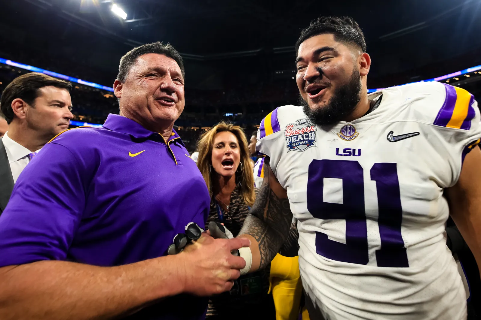Former LSU DT Breiden Fehoko and head coach Ed Orgeron