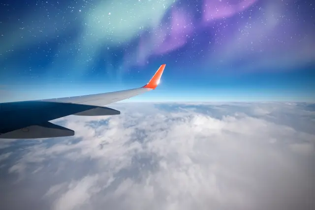 A view of a northern lights display from a plane.