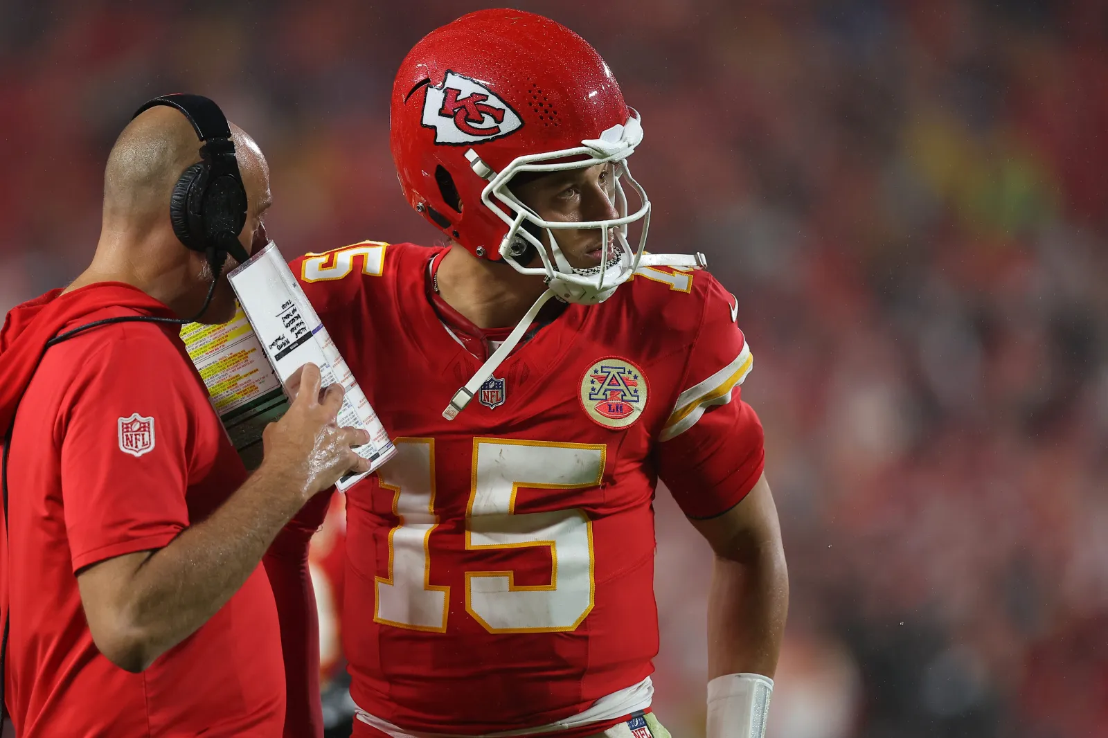 Offensive coordinator Matt Nagy of the Kansas City Chiefs speaks to Patrick Mahomes #15