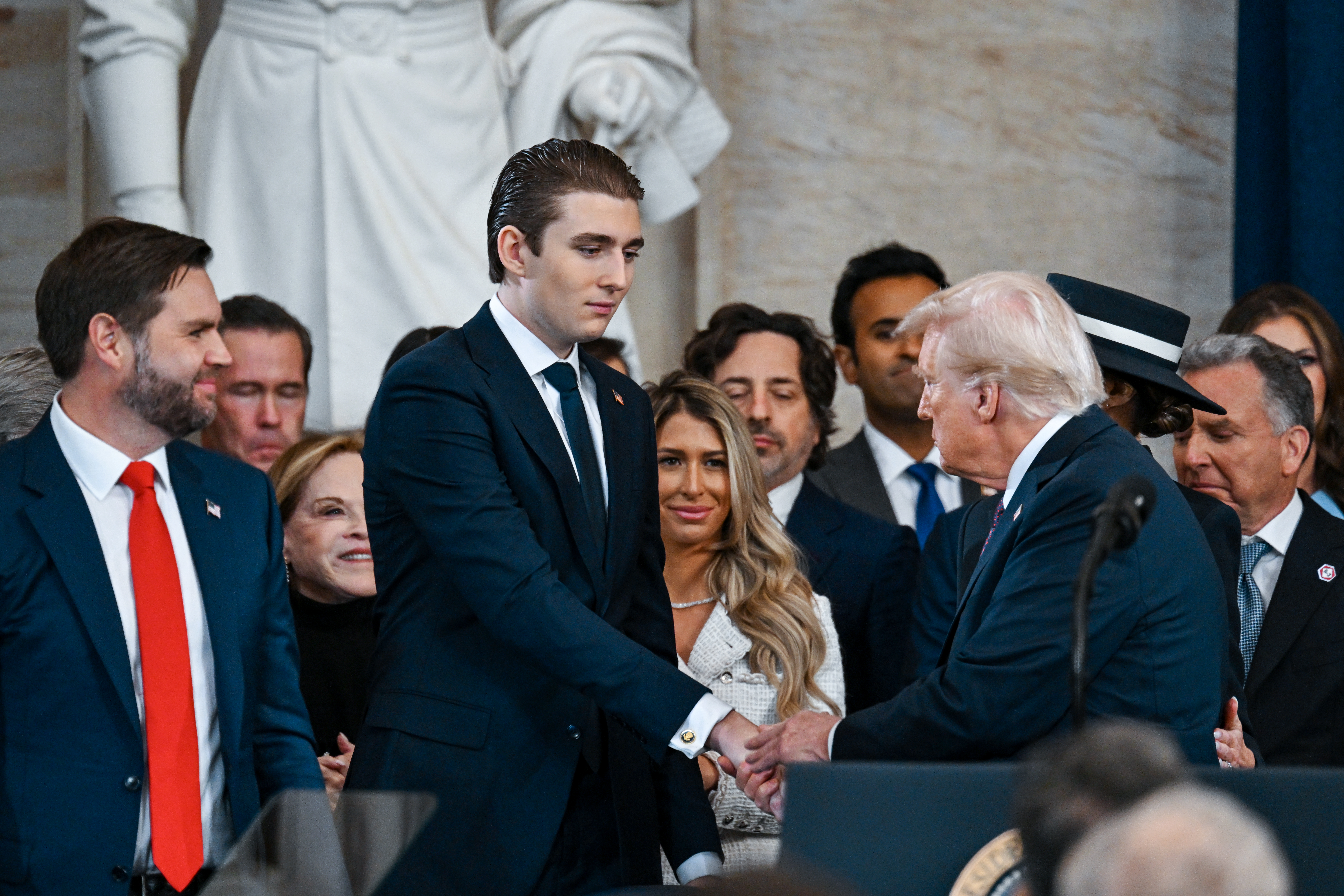 Barron Trump’s Thanksgiving Appearance With Father Goes Viral