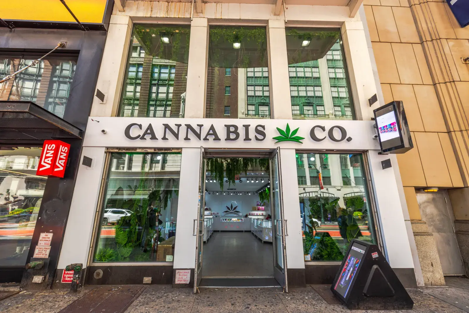 A Cannabis store entrance in an urban shopping district of New York City.