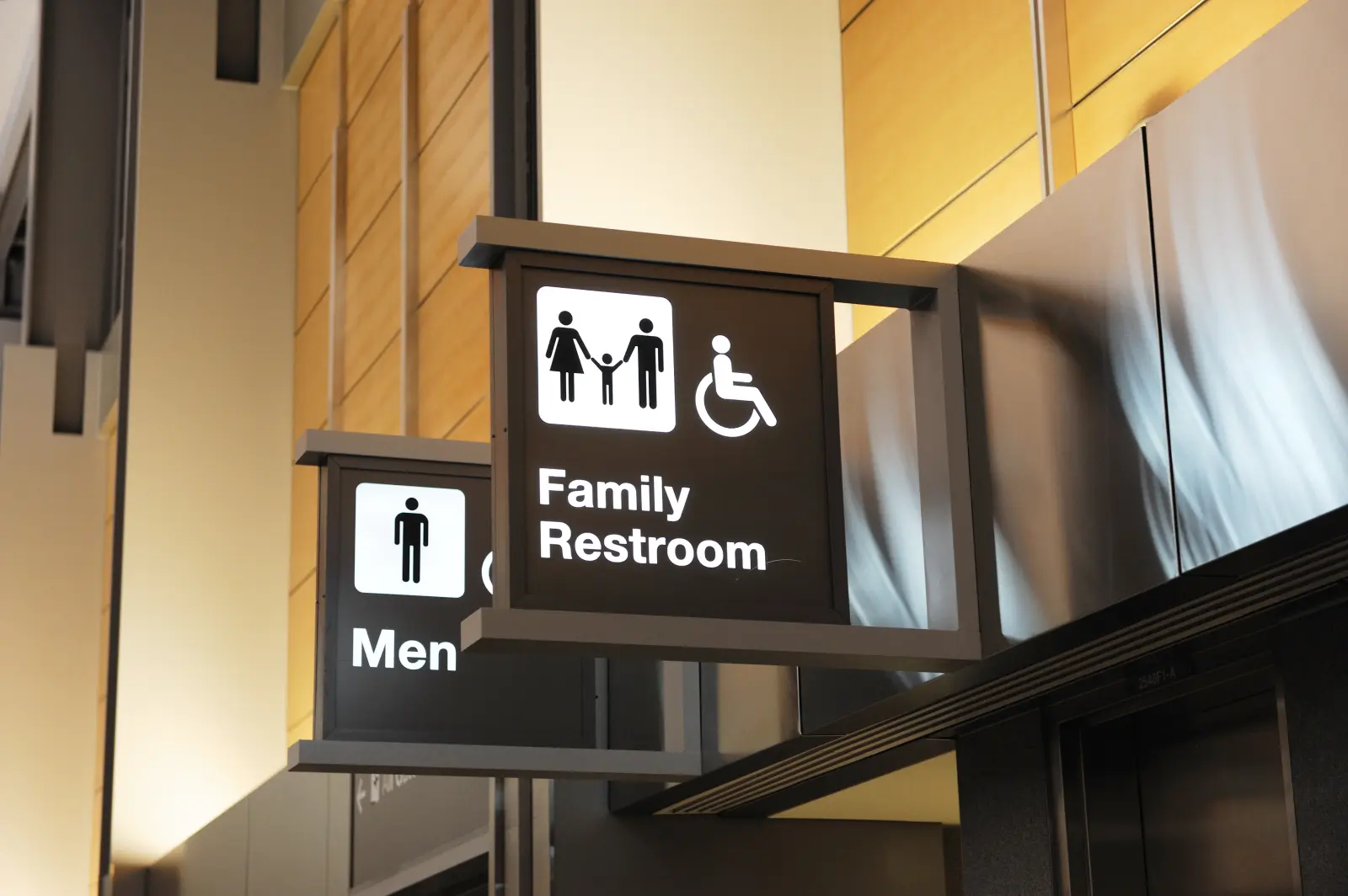 A restroom sign inside an office building