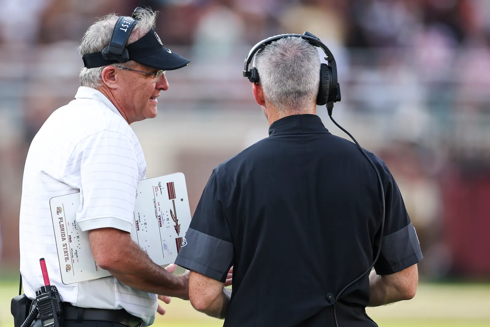 Offensive Coordinator Gus Malzahn talks with Head coach Mike Norvell of the Florida State Seminoles
