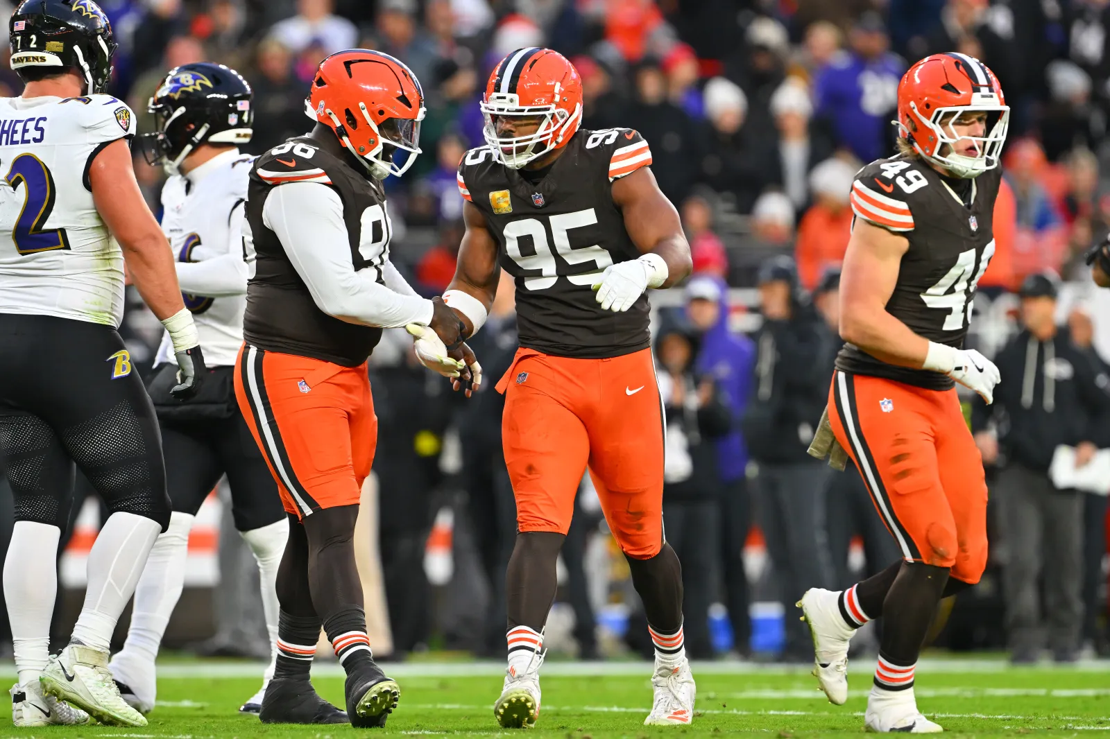 Defensive tackle Maliek Collins celebrates with defensive end Myles Garrett.