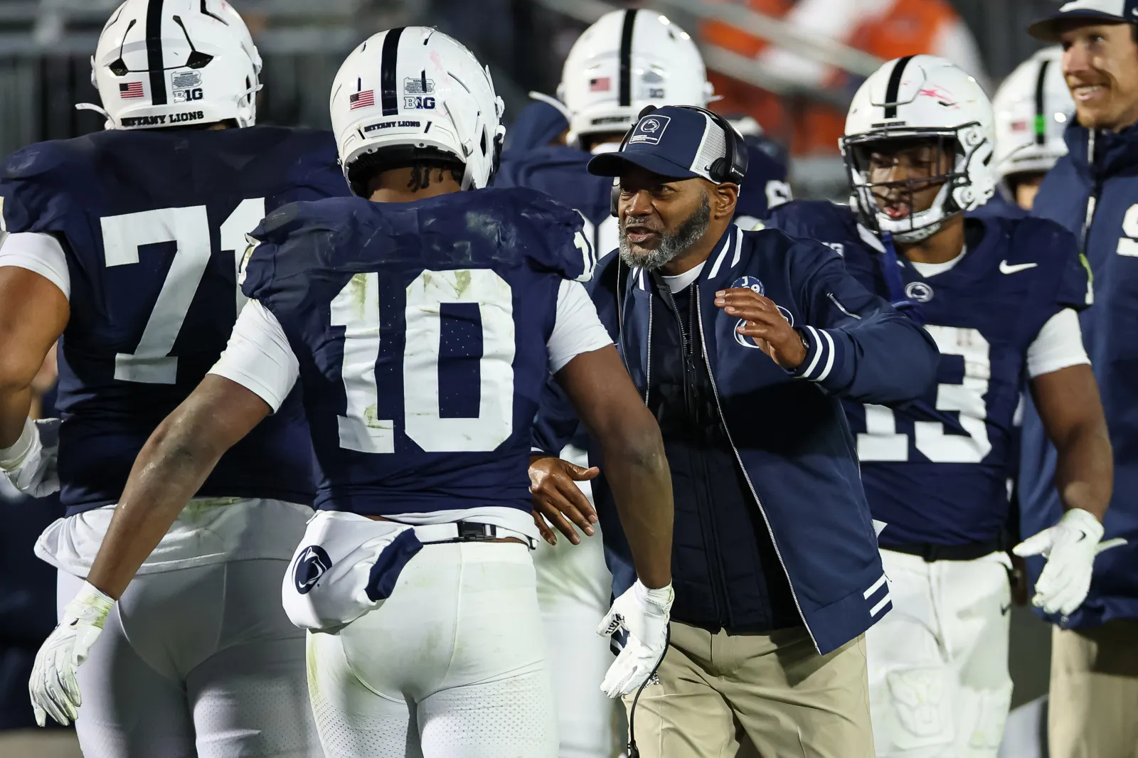Penn State Nittany Lions players celebrate with interim head coach Terry Smith