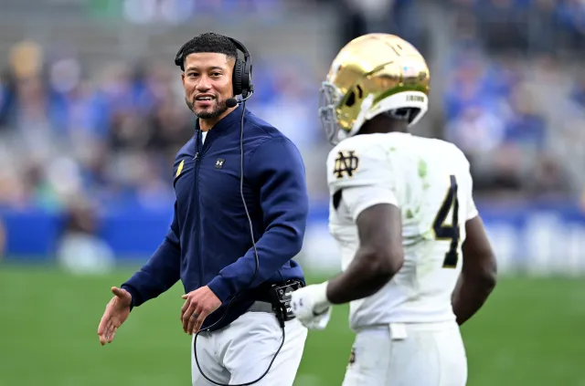 Notre Dame head coach Marcus Freeman with Jeremiyah Love