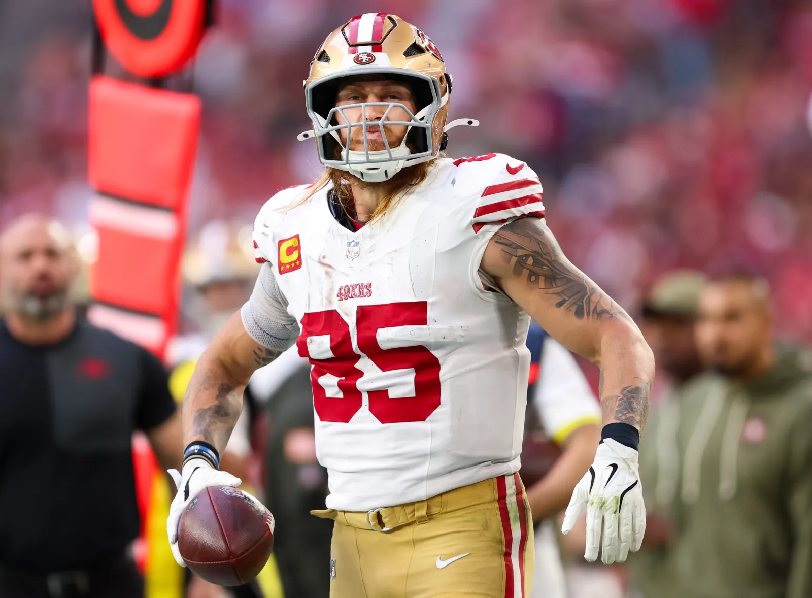 San Francisco 49ers star George Kittle on field against Cardinals