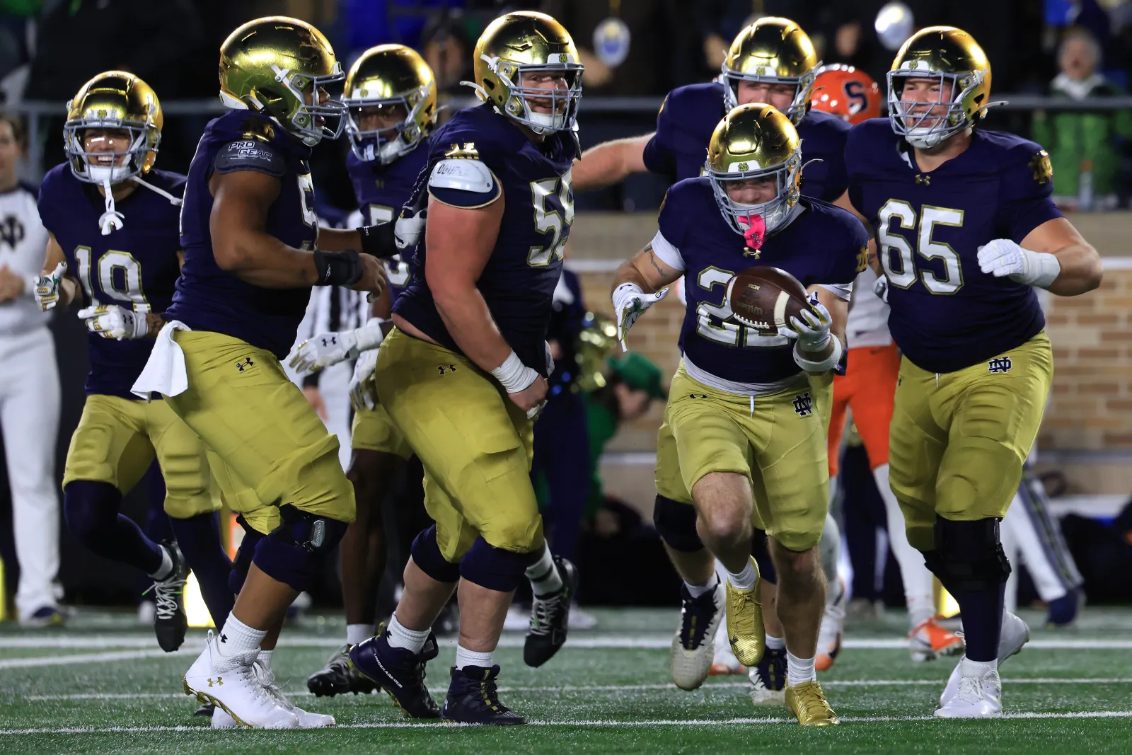 Aneyas Williams #22 of the Notre Dame Fighting Irish celebrates a touchdown during the fourth quarter against the Syracuse Orange at Notre Dame Stadium in South Bend, Indiana.