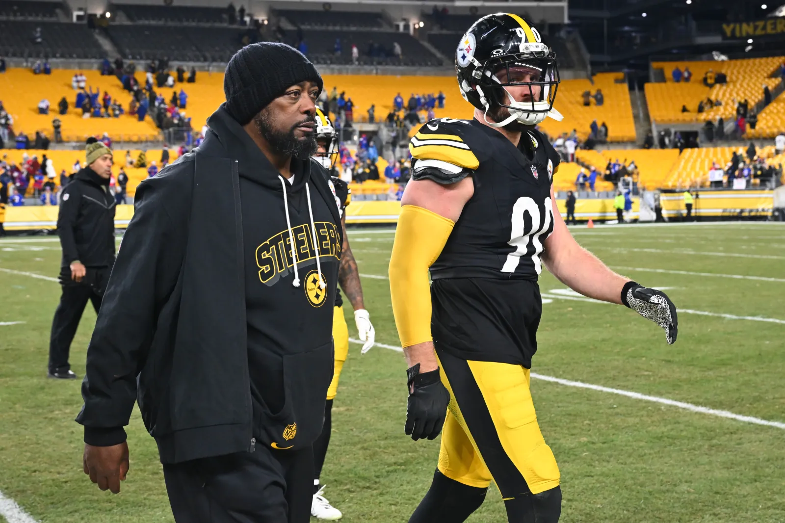 Head coach Mike Tomlin and T.J. Watt #90 of the Pittsburgh Steelers