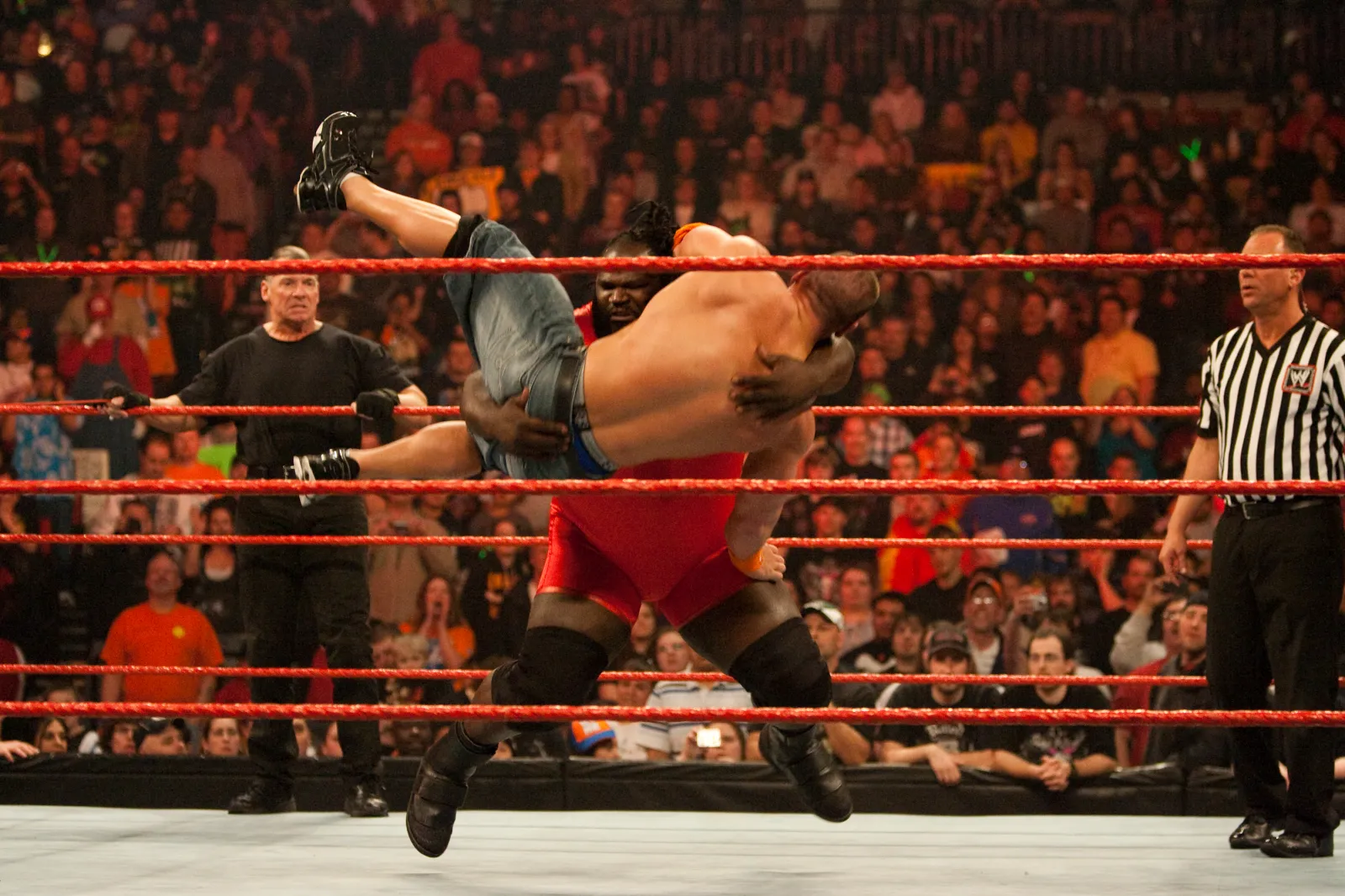 Mark Henry slams John Cena in a WWE Monday Night Raw match