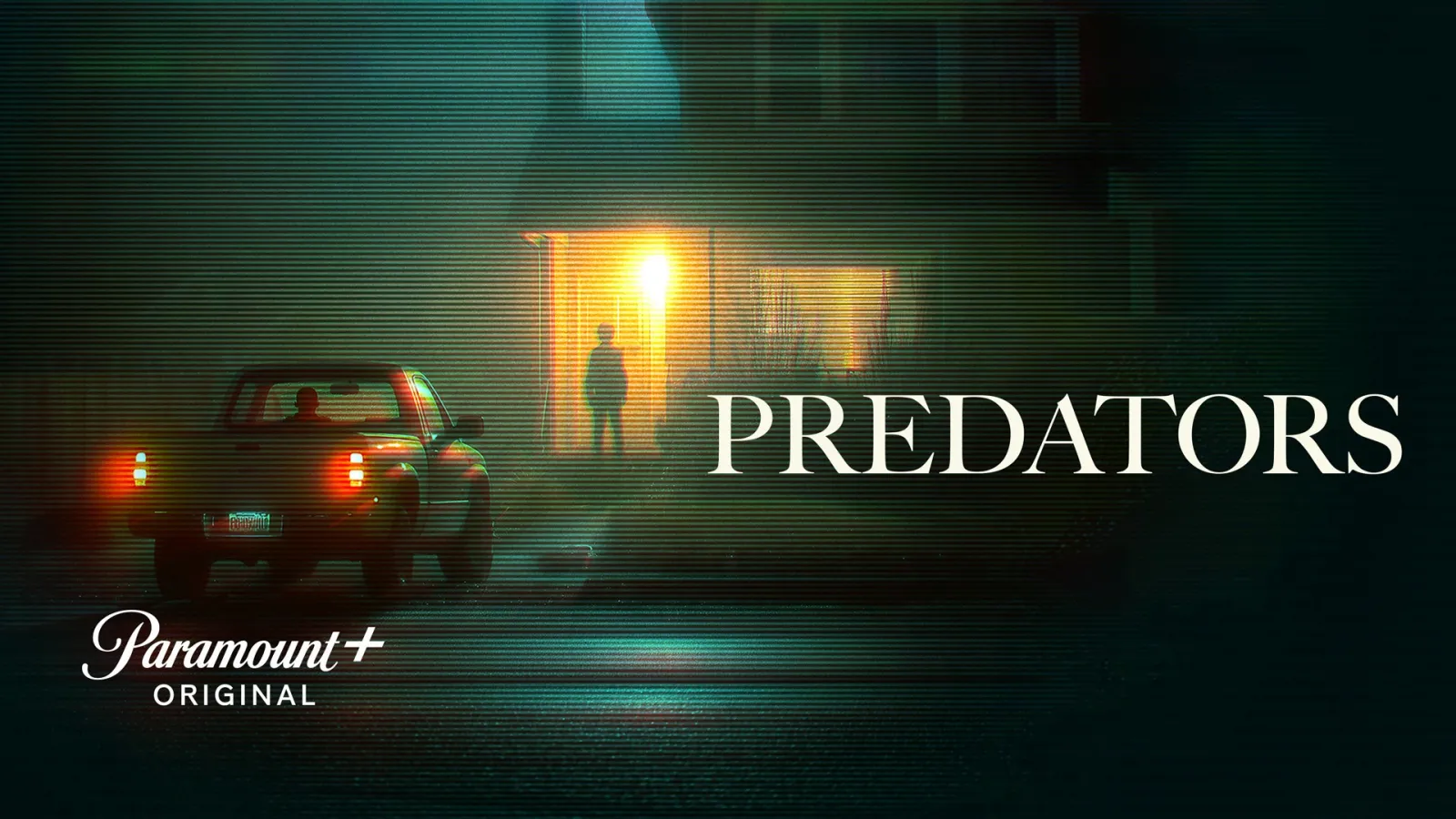 A car parked outside a house at night