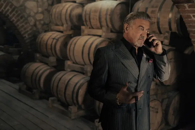 Sylvester Stallone talking into a cellphone