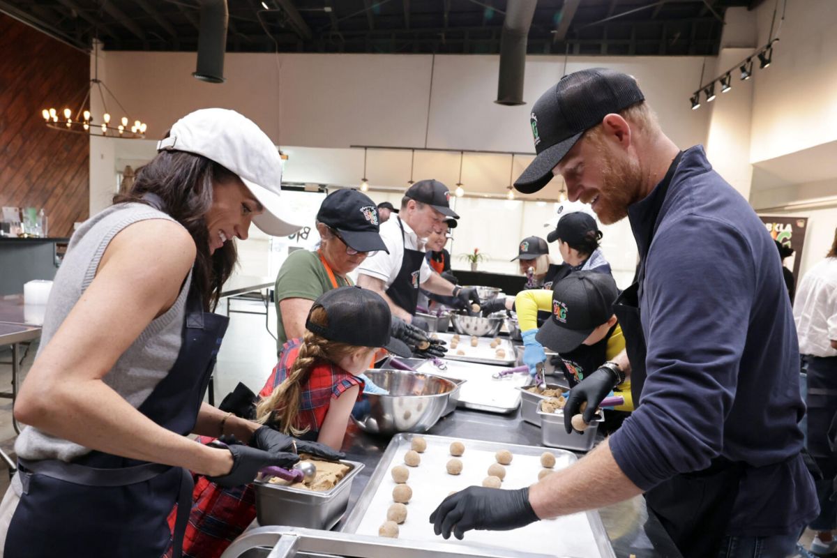 Meghan Markle, Prince Harry, Princess Lilibet, and Prince Archie at Community Kitchen