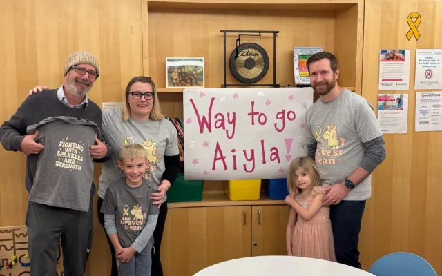 Aiyla ringing the bell